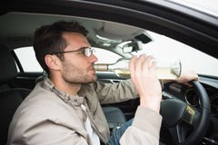 man-drinking-beer-driving-his-car-49211561.jpg